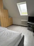Kleine Ferienwohnung , Direkt am Deich und Hafen von Eckwarden mit Gartennutzung