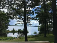 Escape to the Northwoods at this picturesque Sand Lake home