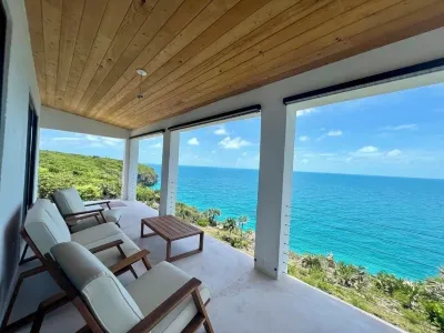 Big Pink:mid-century modern 2bedroom oceanfront home on cliffs of Gregory Town Hotel a 