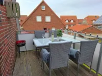 Apartment Lüttje Amselnüst - central location directly on the dike with balcony