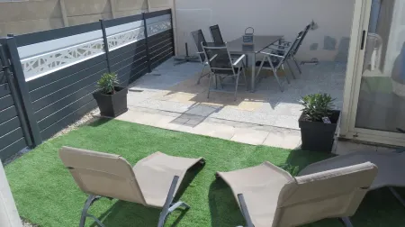 House near beach, port and shops, quiet area, private parking and courtyard.