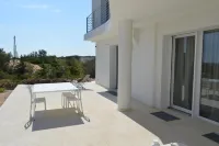 Seafront Juniper apartment with large veranda, 20m from the crystal clear sea.