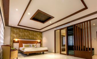 a modern bedroom with a large bed , white walls , and a skylight above the bed at The Fern Residency Vijayapura