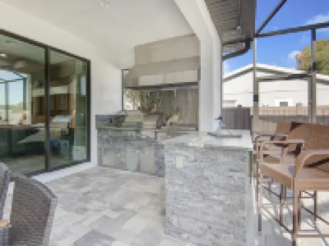 Amazing Outdoor kitchen & Private Screened In Pool Hotels in Estero