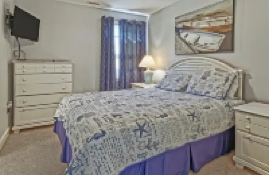 Bright and Airy Condo.  One block to the Beach.  Great location.