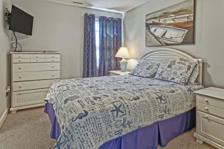 Bright and Airy Condo.  One block to the Beach.  Great location.