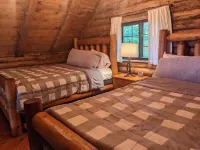 Rustic Retreat Log Cabin Nestled Among 65 Acres