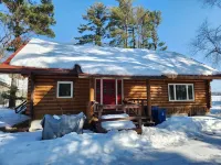 cozy lake house, full log cabin on beautiful shell lake, w/ wonderful loft.