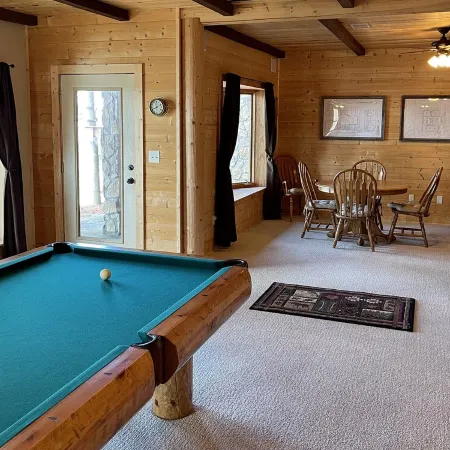 Large six-bedroom loghome w/ private boat ramp, dock, movie room and pool room.