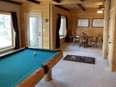 Large six-bedroom loghome w/ private boat ramp, dock, movie room and pool room.