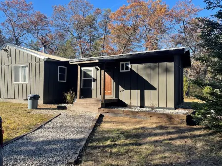 Minutes to town or very peaceful woods retreat! Close to trails and golf.