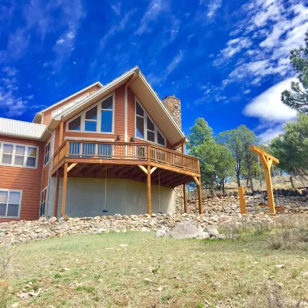 Spectacular panoramic mtn views from this majestic 3 acre luxury chalet retreat