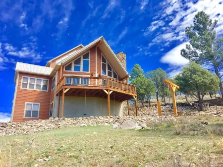 Spectacular panoramic mtn views from this majestic 3 acre luxury chalet retreat
