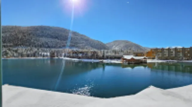 Chic Condo with Stunning Lake and Mountain Views - Inviting Escape