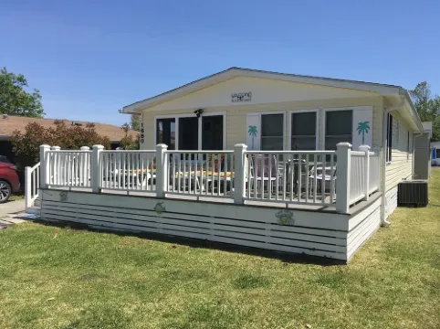 “Tiki time Getaway” -dog friendly, sleeps 6. Corner of splash pad and pool.