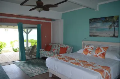 Beachfront one bedroom studio with full kitchen, covered porch and open deck. Hotels in 