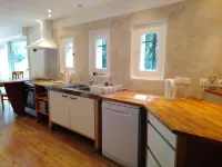 Large garden with swimming pool.