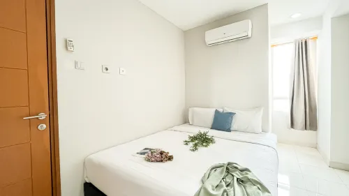 Scandinavian Minimalist 2BR at Cinere Bellevue Suites Apartment By Travelio