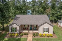 Cozy lakefront home with beautiful views, fire pit & private dock.