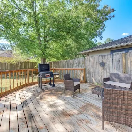 King bed with Pool table, decked patio and, gym.