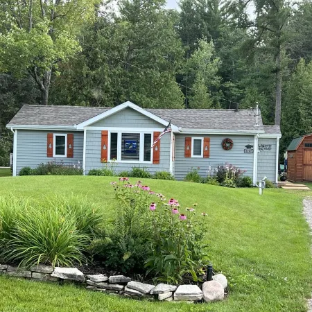 Riverfront Cottage w/ Boat Docking and easy access to Burt Lake