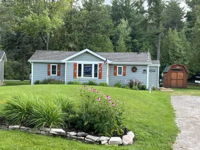 Riverfront Cottage w/ Boat Docking and easy access to Burt Lake