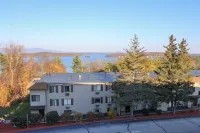 Water view condo with a pool, tennis court, fireplace, balcony & golf nearby