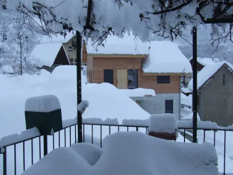 Lovely village house with a view of lake and mountain VAUJANY on the other side Alpe d'Huez