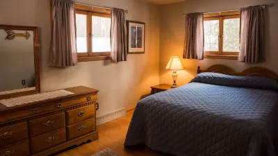 Escape to the Northwoods at this picturesque Sand Lake home