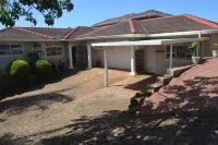 Cozy one bedroom suite, with a balcony, overlooking the pool and braai area.