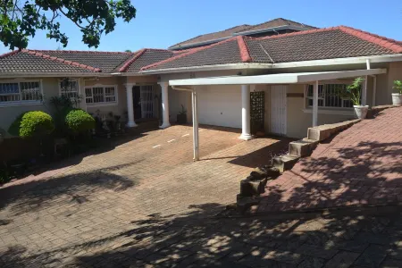 Cozy one bedroom suite, with a balcony, overlooking the pool and braai area.