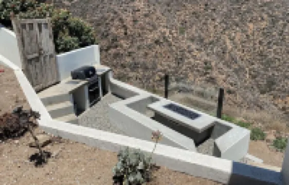 Eclectic Cliffside Den with Hanging Living Area