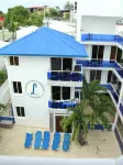 Condo face à épicerie à 3 minutes de la plage 302 فنادق في 