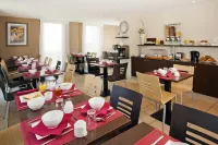 Séjours & Affaires Caen le Clos Beaumois - Desayuno