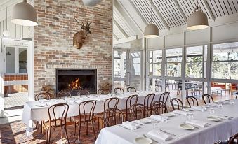 a dining room with tables and chairs arranged for a group of people to enjoy a meal together at Camden Valley Inn