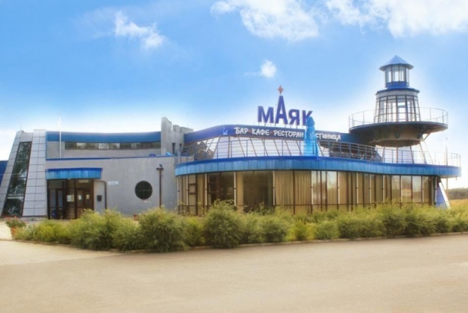 "a modern building with the name "" mark "" and the skypark centre national logo , situated on a sunny day" at Mayak