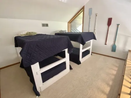 Beautiful Home w/ 2 fireplaces, Deck, and 75ft of Private Higgins Lake Frontage