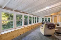 Secluded cabin surrounded by mountains, waterfalls, wildlife, and 50,000 acres