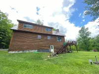 18+ acres! Sun drenched 5 bedroom. 12 min from Okemo! VAST trails 5 min away!