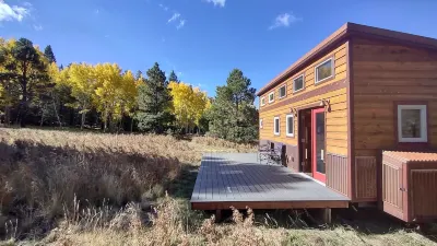 Tiny house on the prairie with mountain views.