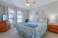 Poolside Deck and Tennis Court Views - Charming Coastal Escape