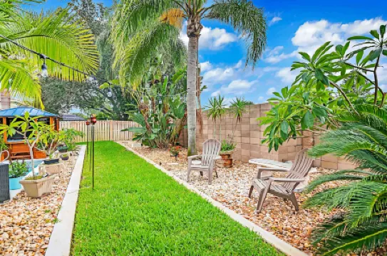 Urban Oasis W/Hot Tub, Heated Pool and Private Movie Theater 2 Bedroom Home by RedAwning