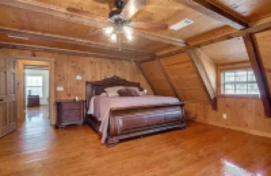 Unwind with the whole family at this serene 5-bedroom cabin retreat