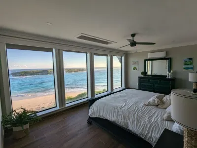 Beachfront estate home with private 70’ dock and 7500sq ft. of living space