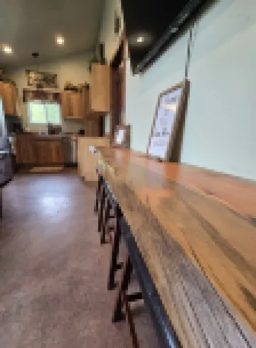 Themed Bear's Den Cabin__nestled in the pines minutes outside of Glacier Park.