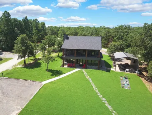 Richland Chambers Lakefront 2-story home with boat dock and pavilions.