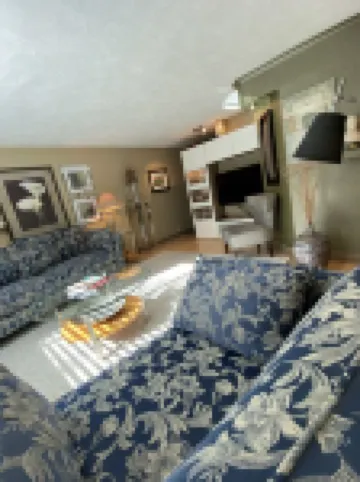 Elegant Townhome, park-like setting. Local event transportation provided.