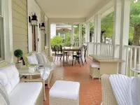 Designer Retreat in Quaint Historic District w Front Porch Dining under the oaks