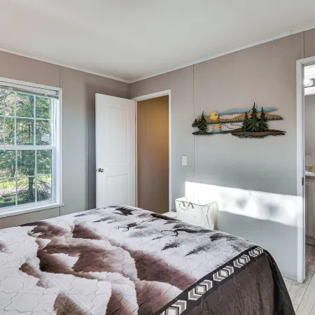 Cozy Wooded Retreat by the Rifle River