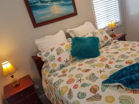 A delightful riverside house -comfortable and stylish - in Urunga